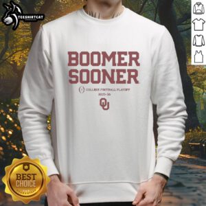 Alt Text: Happy Oklahoma Sooners Football Boomer Sooner 2025-2026 CFP sweatshirt featuring team colors and logo.