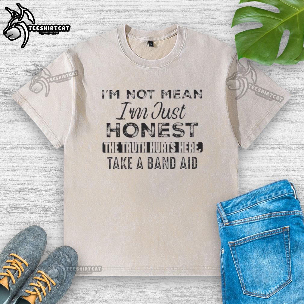 Alt Text: Washed t-shirt with 'Nice, I'm Not Mean, I'm Just Honest' quote and band-aid graphic, perfect for truth lovers.