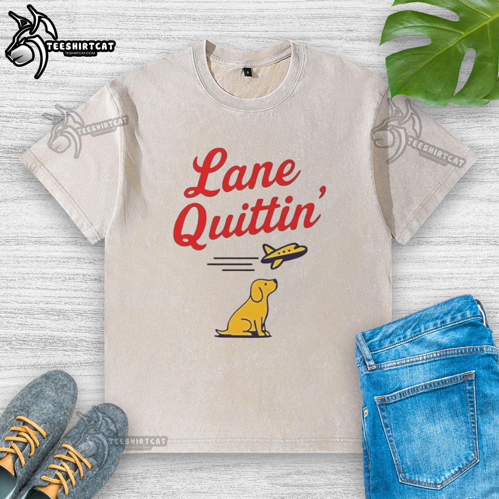 Lane Kiffin football coach wearing a washed t-shirt with a dog and plane graphic at Nice Lane event.