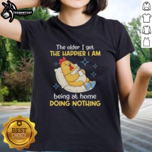 Nice ladies tee featuring 'The Older I Get, The Happier I Am Being at Home Doing Nothing' design in a cozy setting.