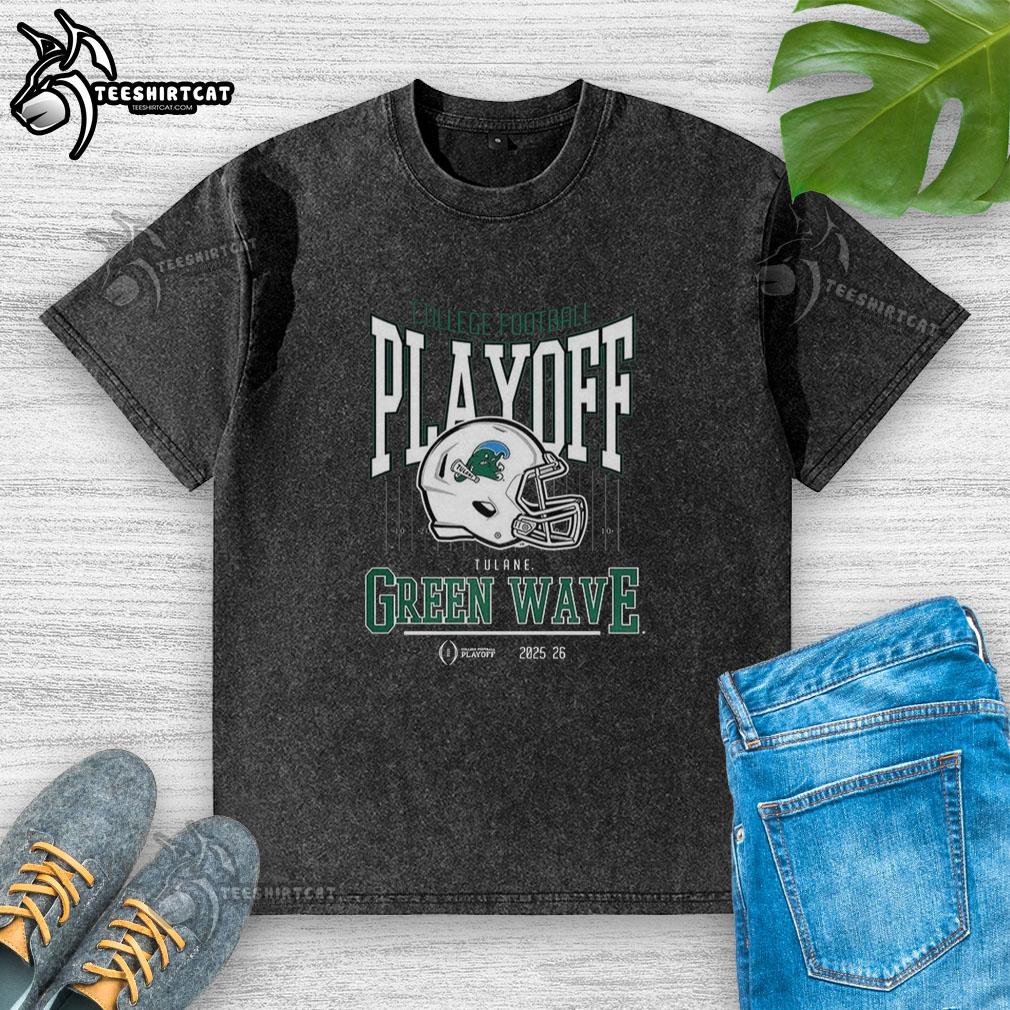 Alt Text: Tulane Green Wave NCAA 2025-2026 College Football Playoff curved helmet design on a washed t-shirt.