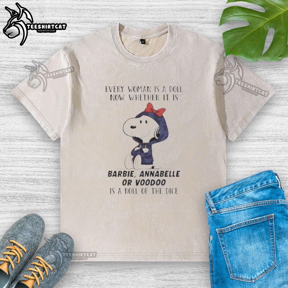 Official Peanuts Every Woman Is A Doll T-Shirt featuring Barbie, Annabelle, and Voodoo designs on a dice-washed fabric.