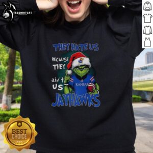 Official Santa Grinch sweatshirt featuring 'They Hate Us Because They Ain't Us' for Kansas Jayhawks fans.