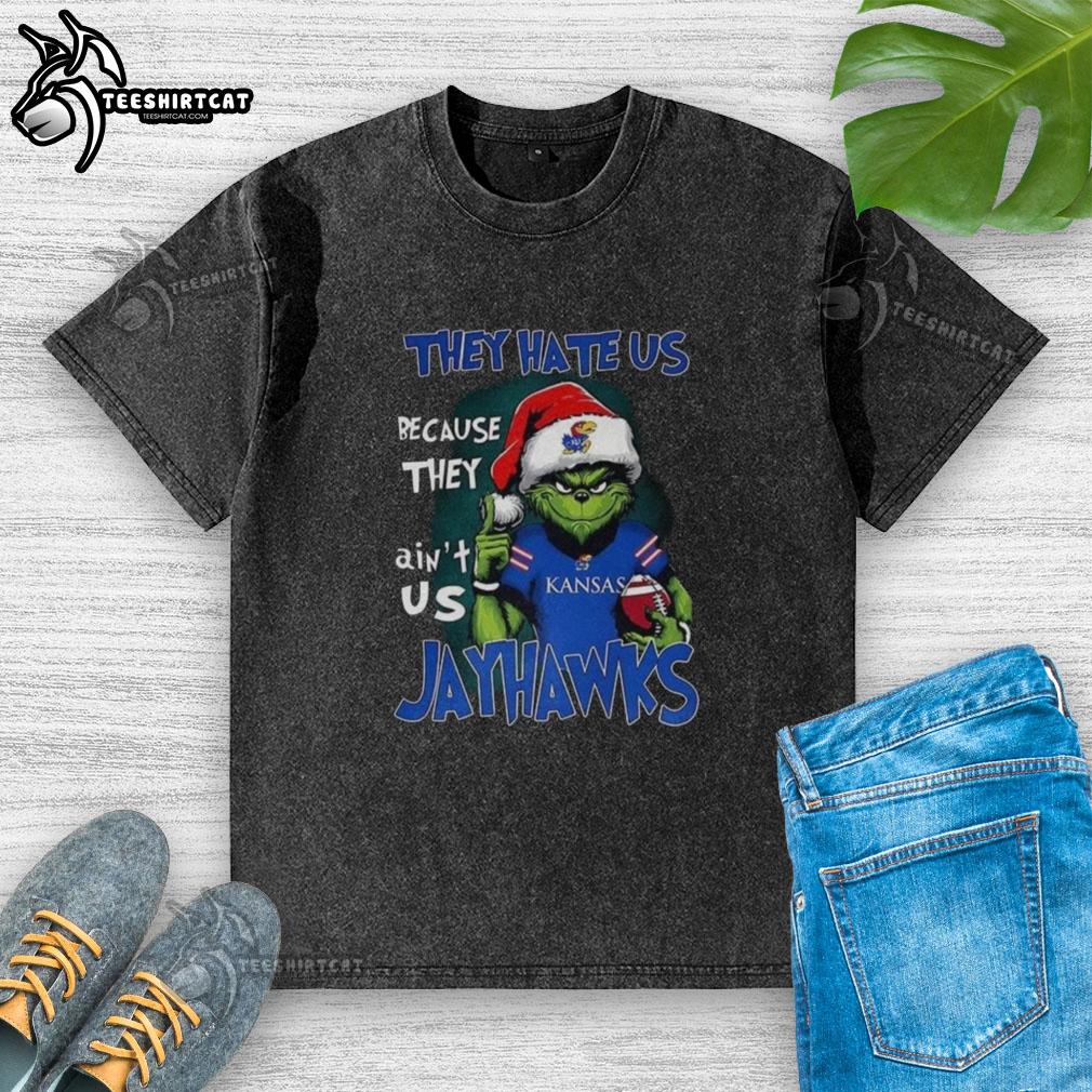 Official Santa Grinch 'They Hate Us Because They Ain't Us' Kansas Jayhawks washed t-shirt featuring colorful graphic design.