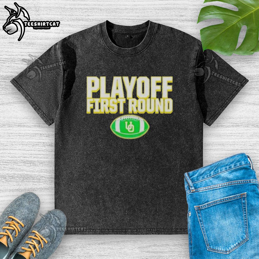 Original Oregon Ducks 2025 CFP First Round Winner washed t-shirt featuring team logo and vintage style design.