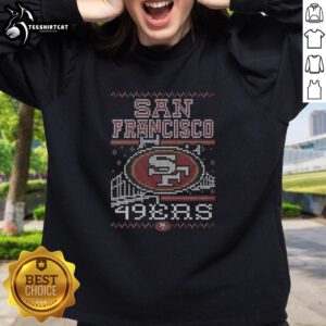 Premium San Francisco 49ers holiday sweatshirt featuring vibrant team colors and festive design for fans.