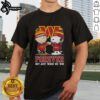 Alt Text: Premium Washington Commanders X Charlie Brown Vs Snoopy T-Shirt featuring a playful design celebrating fandom.