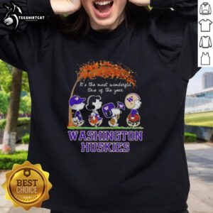 Alt Text: Premium Washington Huskies X Peanuts Snoopy sweatshirt celebrating autumn with vibrant colors and cozy design.