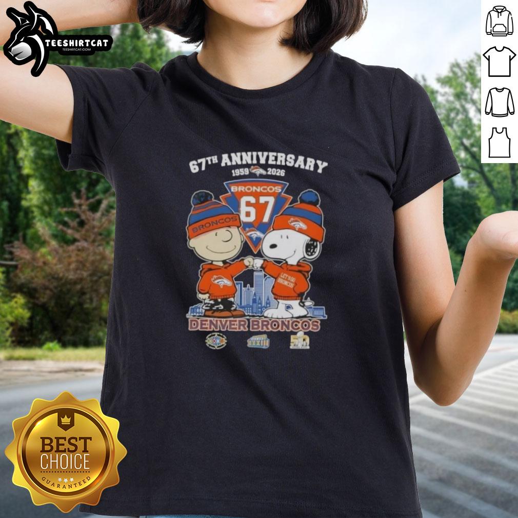 Alt Text: 'Pretty Charlie Brown and Snoopy 67th Anniversary Denver Broncos Football Skyline Ladies Tee design'