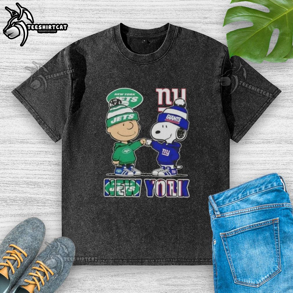 Alt Text: Pretty Charlie Brown fist bump with Snoopy in New York City, wearing Jets x Giants washed t-shirt.