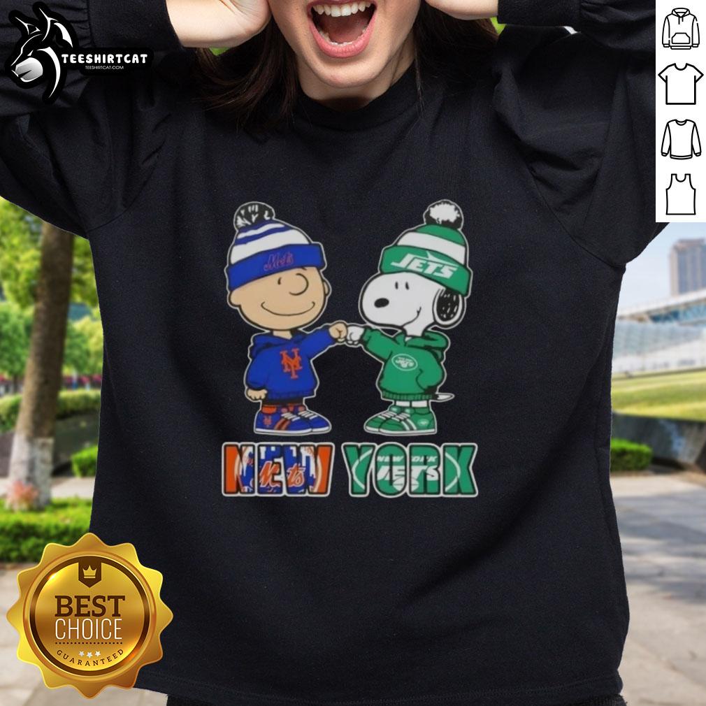 Pretty Charlie Brown fist bump with Snoopy in New York City sports sweatshirt featuring Knicks and Jets logos.