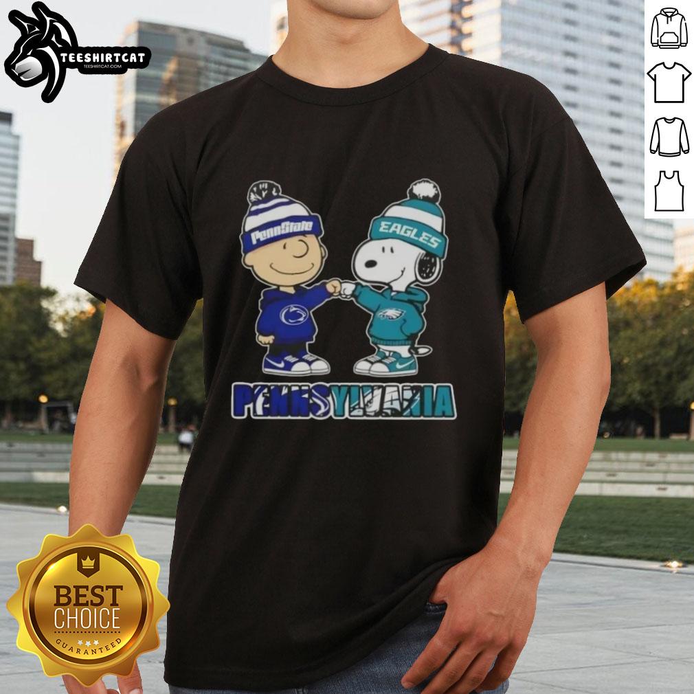 Charlie Brown fist bumping Snoopy on a Nittany Lions Eagles T-shirt, blending Pennsylvania pride with playful cartoon art.
