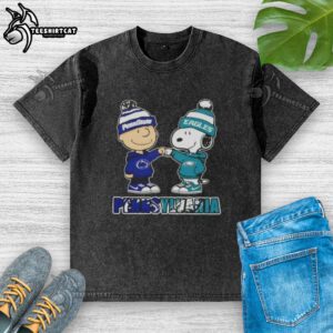 Alt Text: Pretty Charlie Brown fist bump with Snoopy in a Nittany Lions x Philadelphia Eagles washed t-shirt in Pennsylvania city.