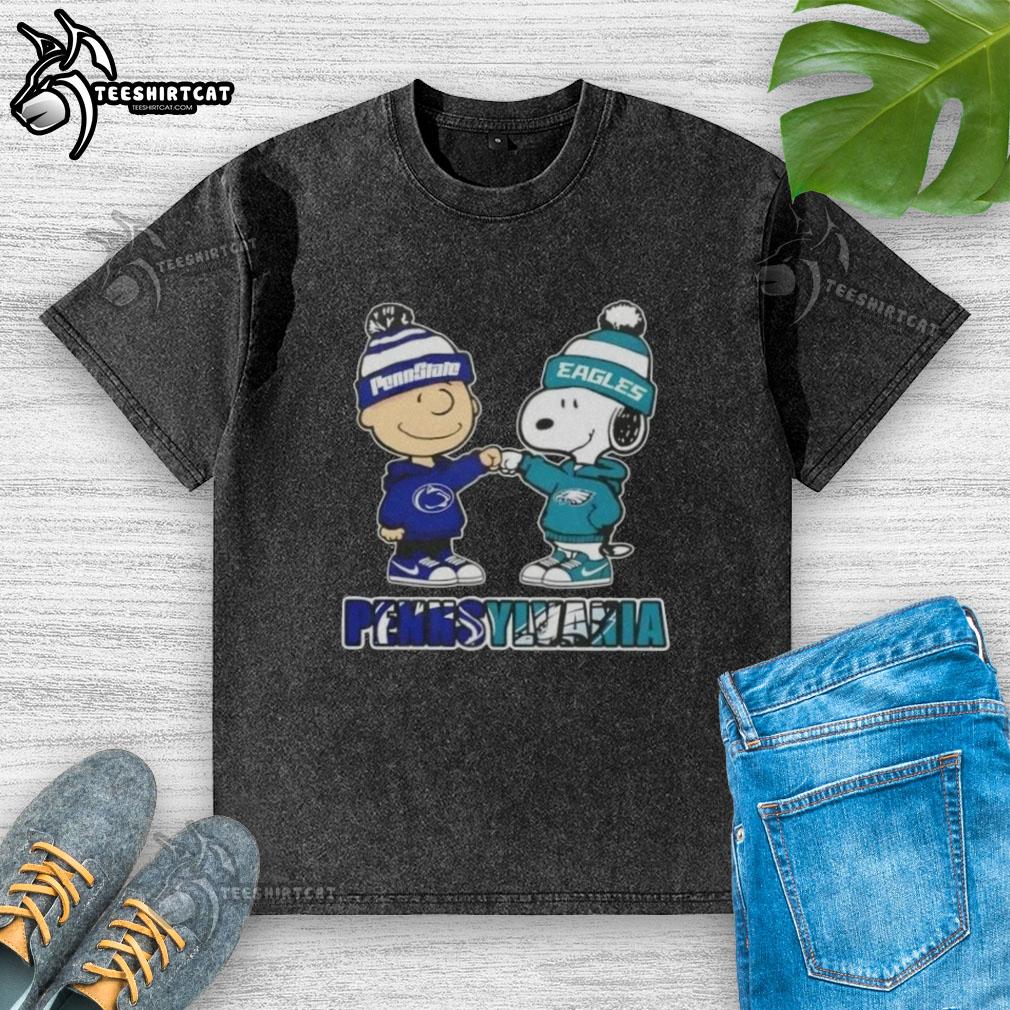 Alt Text: Pretty Charlie Brown fist bump with Snoopy in a Nittany Lions x Philadelphia Eagles washed t-shirt in Pennsylvania city.