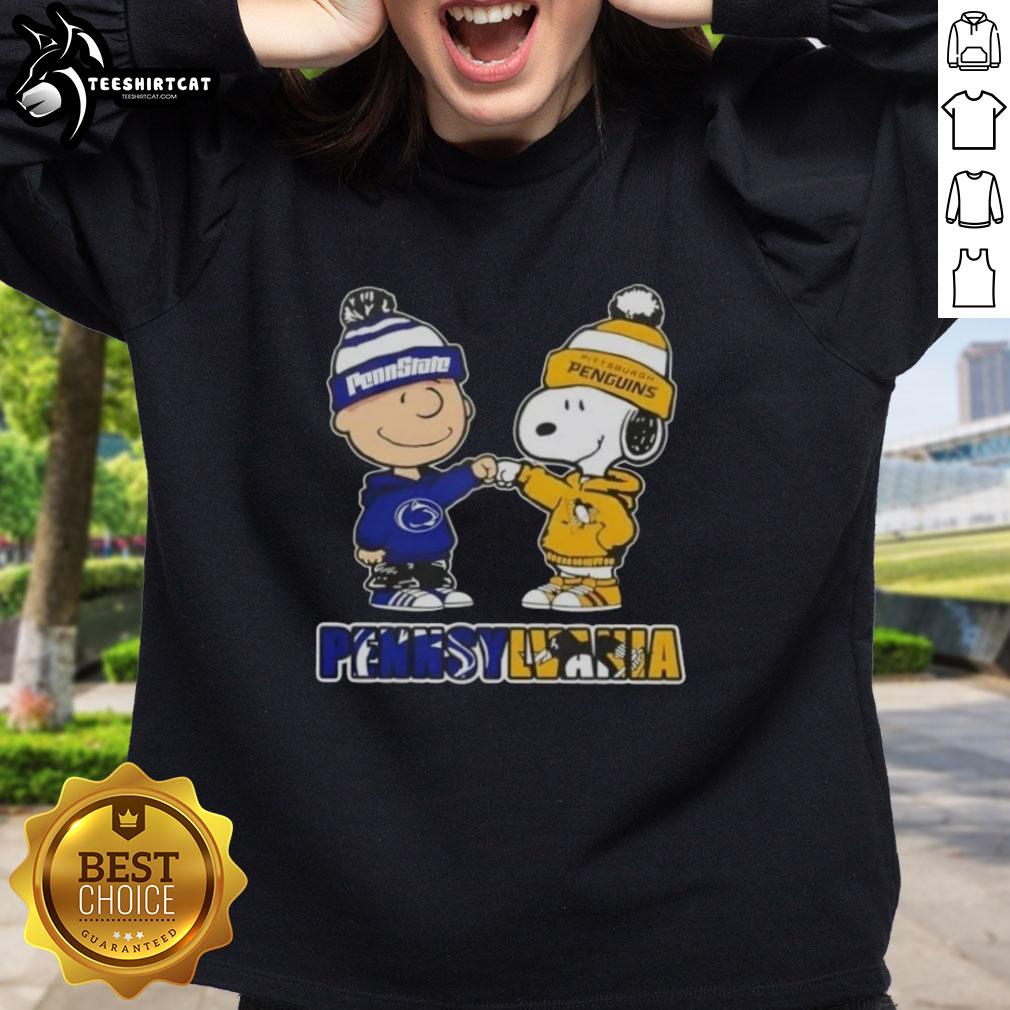 Alt Text: Pretty Charlie Brown fist bump with Snoopy on a Nittany Lions x Pittsburgh Penguins sweatshirt in Pennsylvania.