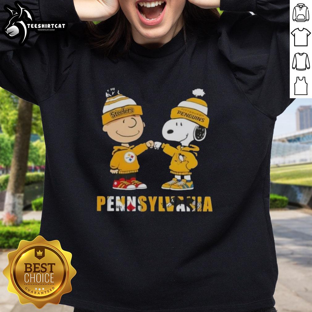 Pretty Charlie Brown fist bump with Snoopy in Pittsburgh Steelers & Penguins sweatshirt, perfect for Pennsylvania city sports fans.