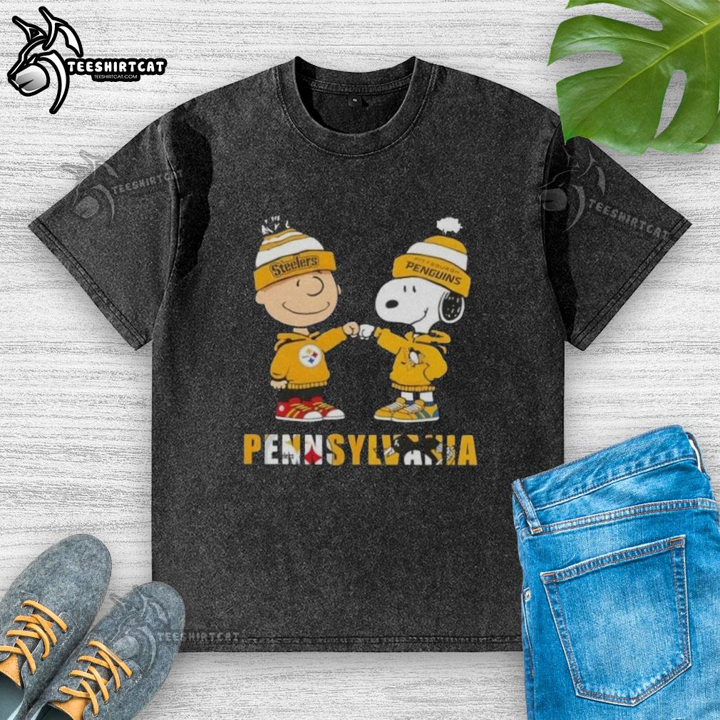Pretty Charlie Brown fist bump with Snoopy in Pittsburgh Steelers and Penguins-themed washed t-shirt, perfect for sports fans.