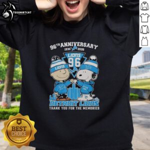 Alt Text: Stylish Detroit Lions outfit featuring a Snoopy and Charlie Brown sweatshirt, celebrating the 96th anniversary (1930-2026).
