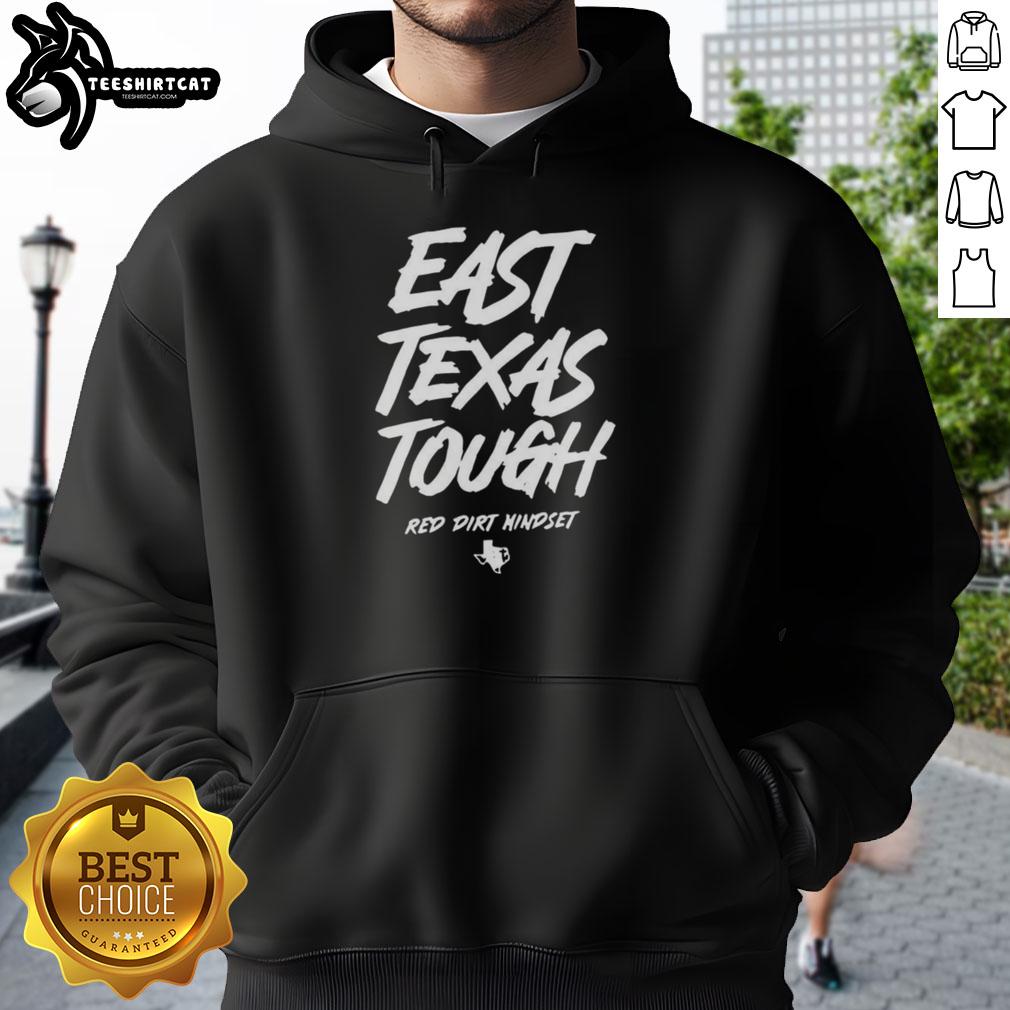 Alt Text: Top East Texas Tough Red Dirt Mindset Letter Hoodie displayed on a rustic wooden background, showcasing its vibrant design.