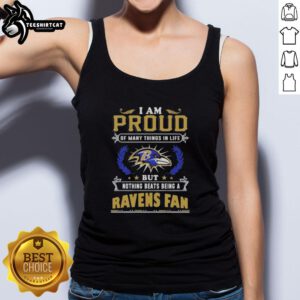 Top featuring 'I Am Proud Of Many Things But Nothing Beats Being A Baltimore Ravens Fan' design in bold lettering.