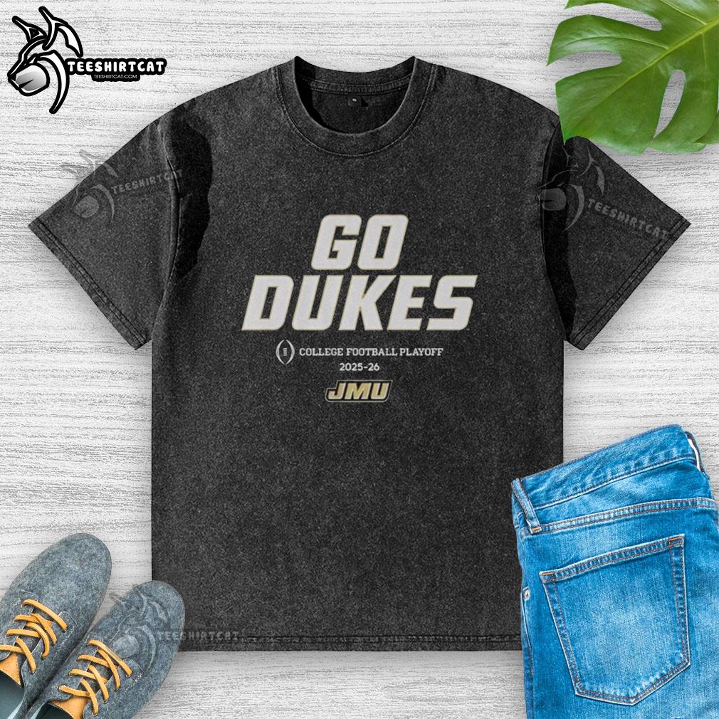 JMU Football 2025 College Football Playoff Team Slogan on a washed t-shirt, showcasing school spirit for Dukes fans.
