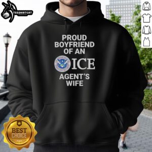 Top Proud Boyfriend of an Ice Agent's Wife Hoodie worn by a smiling man in a casual setting, showcasing stylish design.