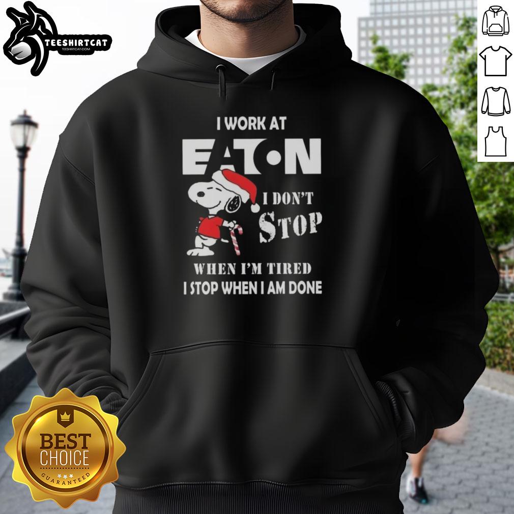 Snoopy hoodie featuring 'I work at Eaton Corporation, I dont stop when Im tired, I stop when Im done' design.