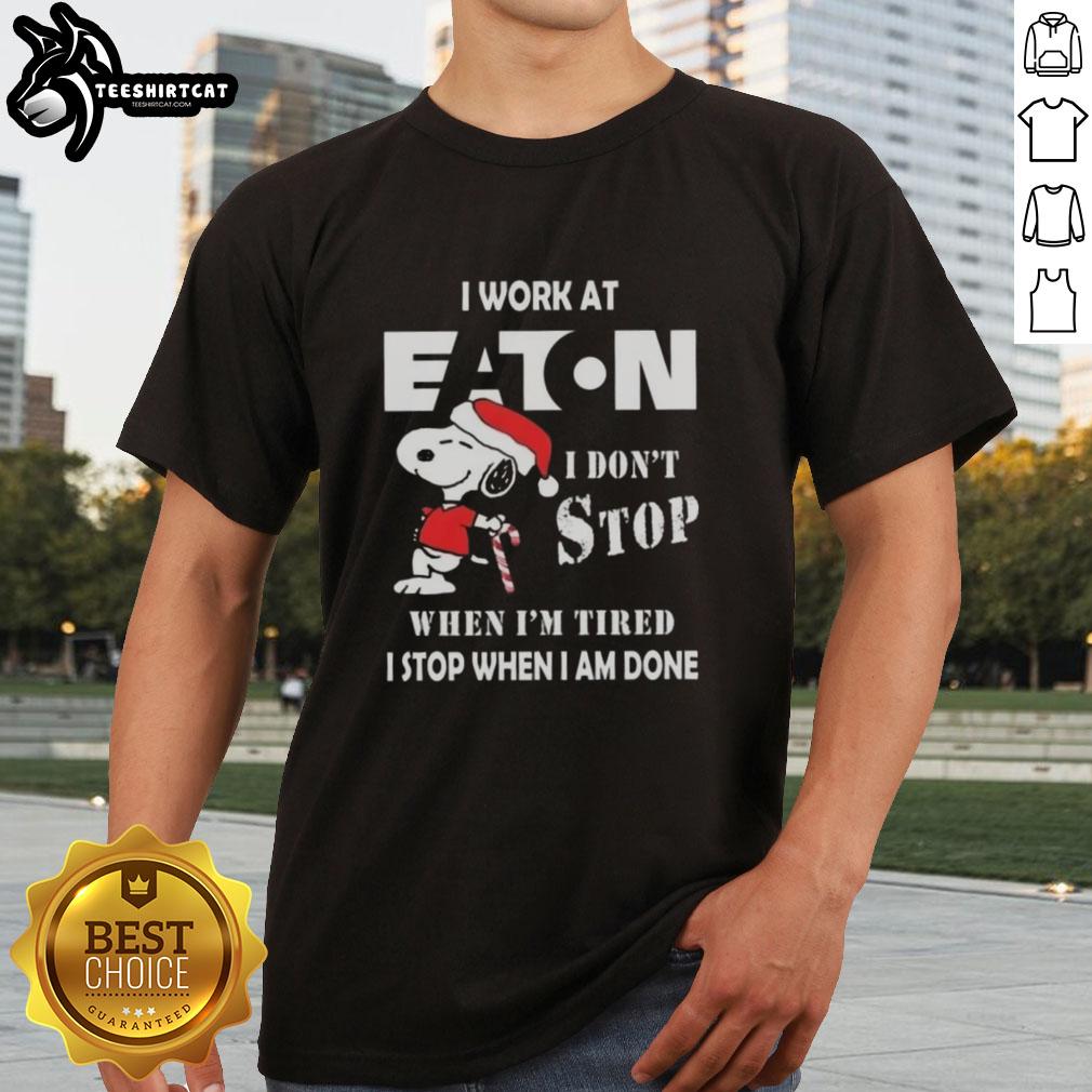 Alt Text: Top Snoopy Christmas T-Shirt for Eaton Corporation - 'I Don't Stop When I'm Tired, I Stop When I'm Done'