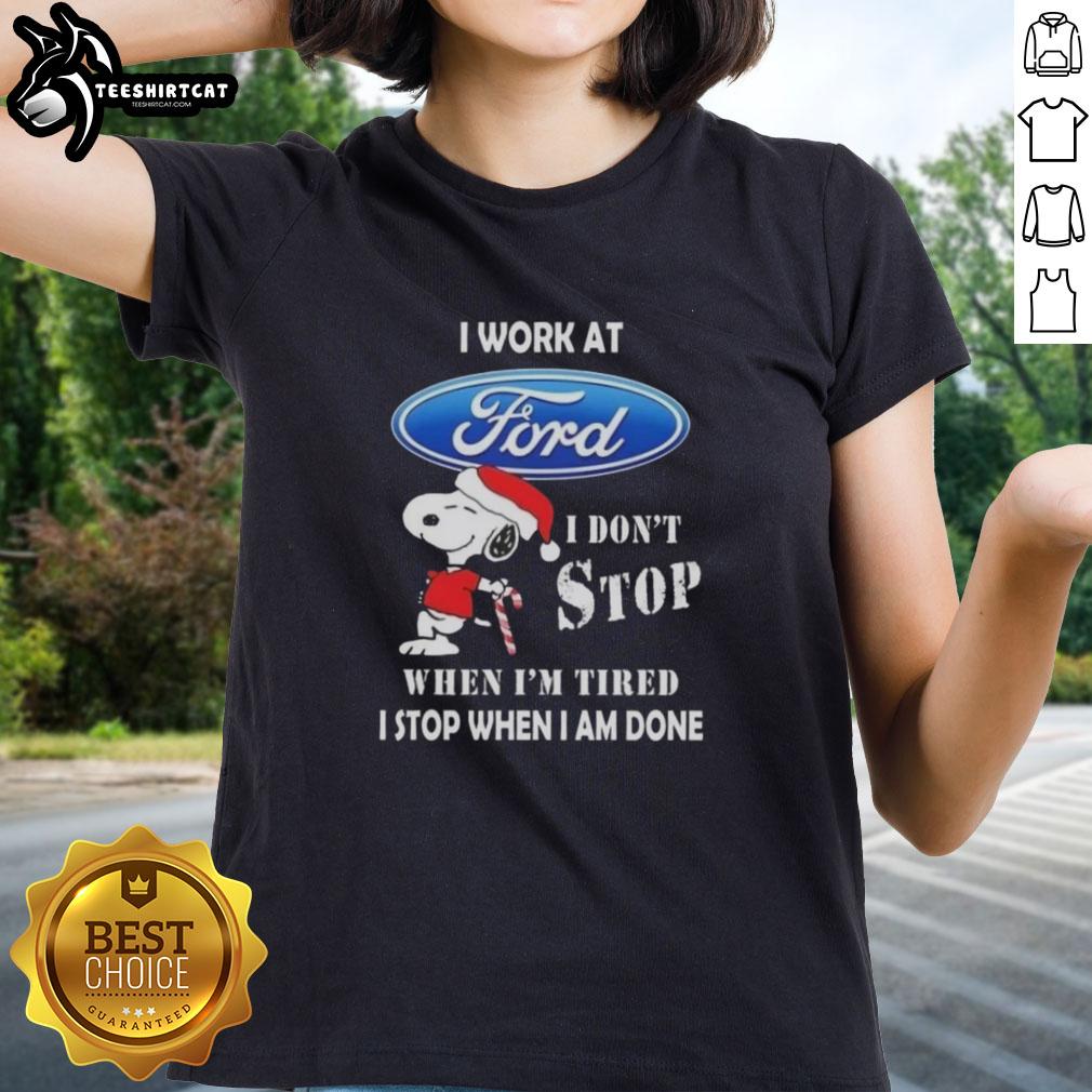 Alt Text: Ladies tee featuring Snoopy with 'I work at Ford Motor, I dont stop when Im tired, I stop when Im done' design.
