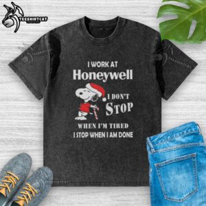 Top Snoopy I Work At Honeywell Christmas T-Shirt showcasing determination and work ethic in a fun design.