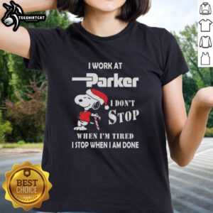 Christmas ladies tee featuring Snoopy with 'I work at Parker Hannifin, I don't stop when I'm tired, I stop when I'm done' text.