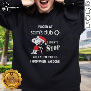 Top Snoopy I Work At Sam's Club Christmas sweatshirt featuring a motivational quote and festive design.