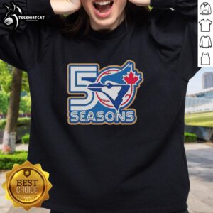 Alt Text: Awesome Toronto Blue Jays 50 Seasons logo sweatshirt featuring vibrant team colors and stylish design.