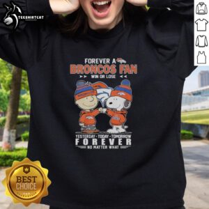 Alt Text: Cute Charlie Brown fist bump with Snoopy, celebrating Denver Broncos fandom in a cozy sweatshirt, win or lose.