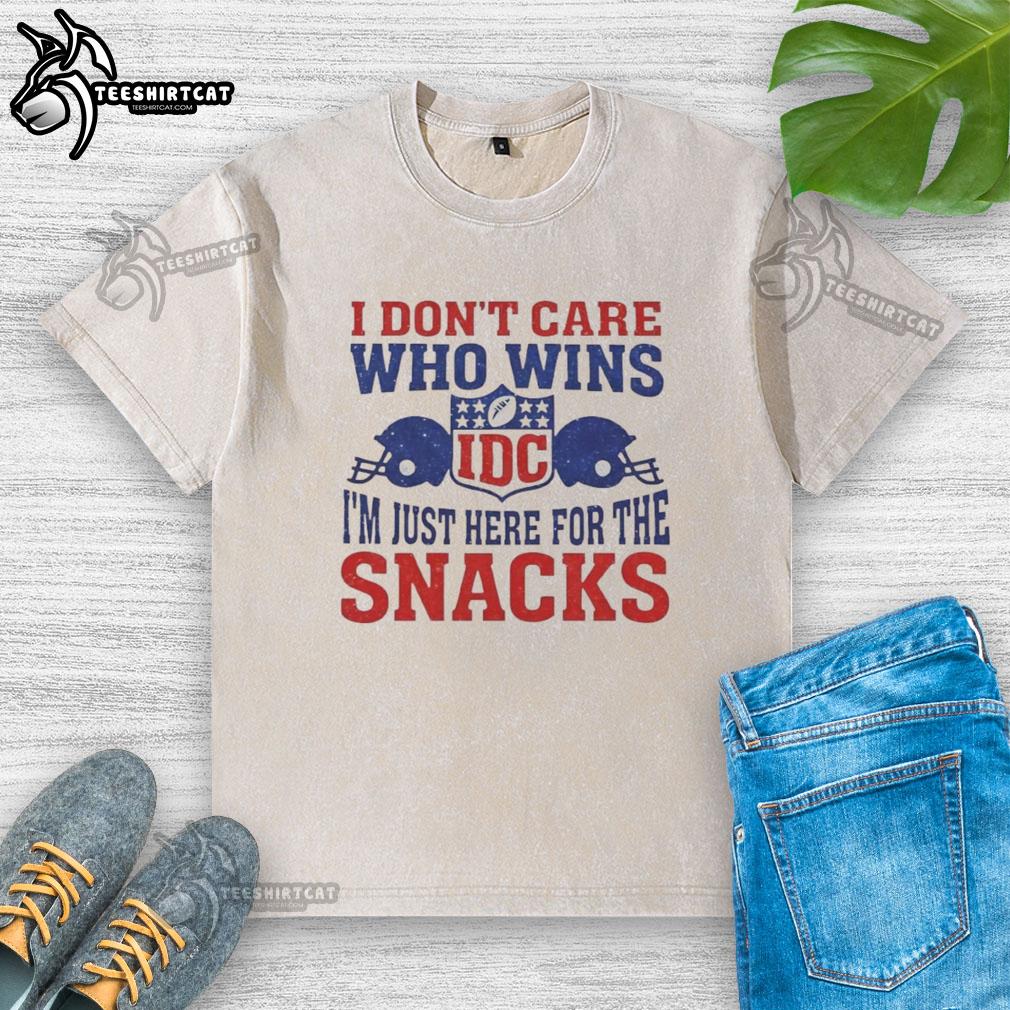 Hot I Don't Care Who Wins NFL T-Shirt featuring 'I'm Just Here for the Snacks' and Two Helmets design.
