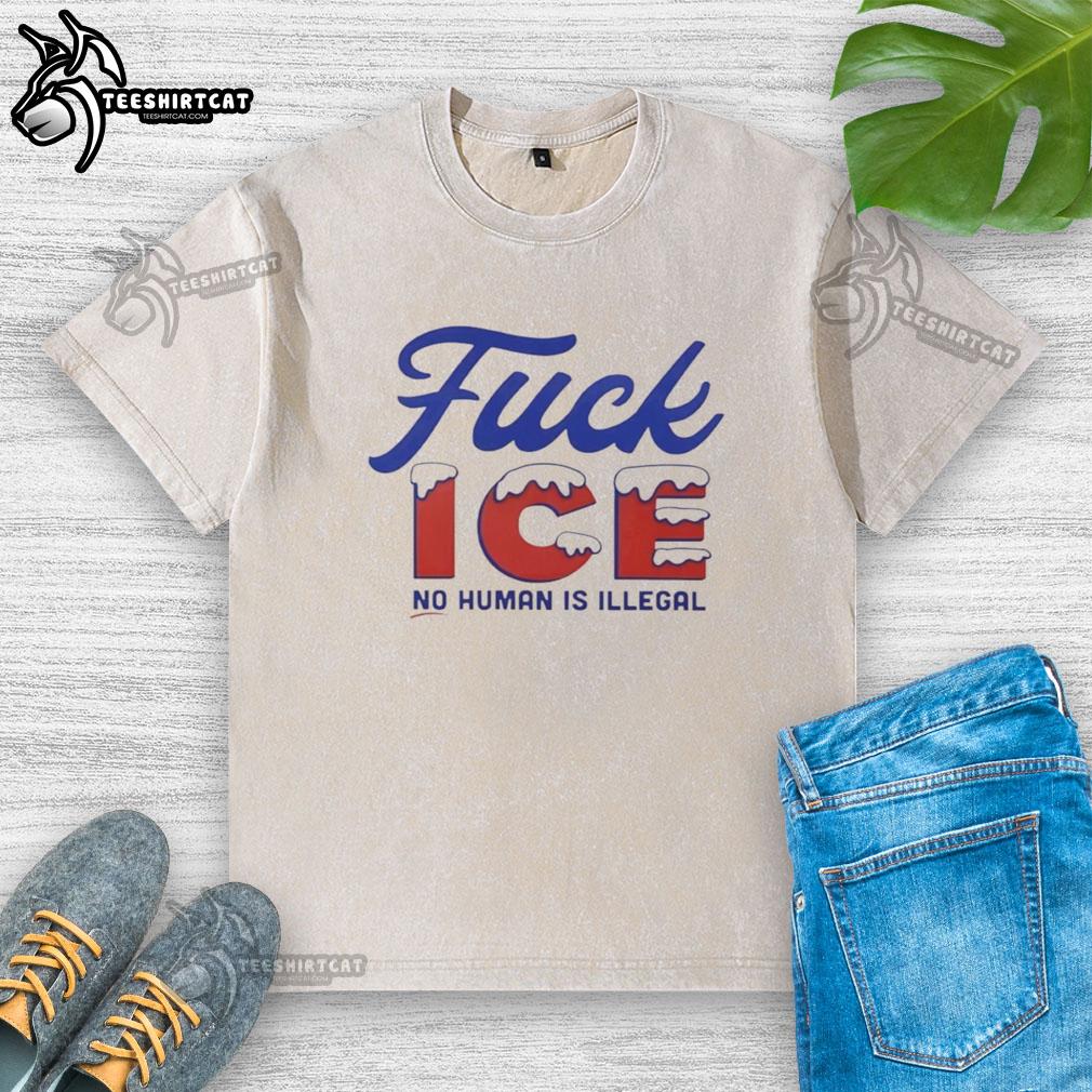 Alt Text: Stylish 'No Human Is Illegal' washed t-shirt with a hot snowy design, perfect for casual wear and social activism.