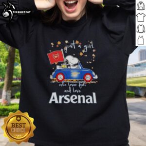 Snoopy driving a car in a fall-themed Arsenal FC sweatshirt, perfect for girls who love autumn and football.