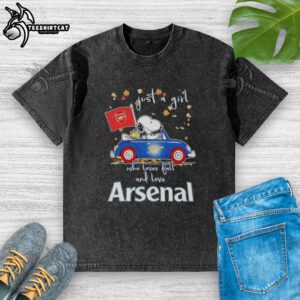Alt Text: Snoopy driving a car on a washed t-shirt, celebrating fall and Arsenal FC, perfect for a girl who loves peanuts.