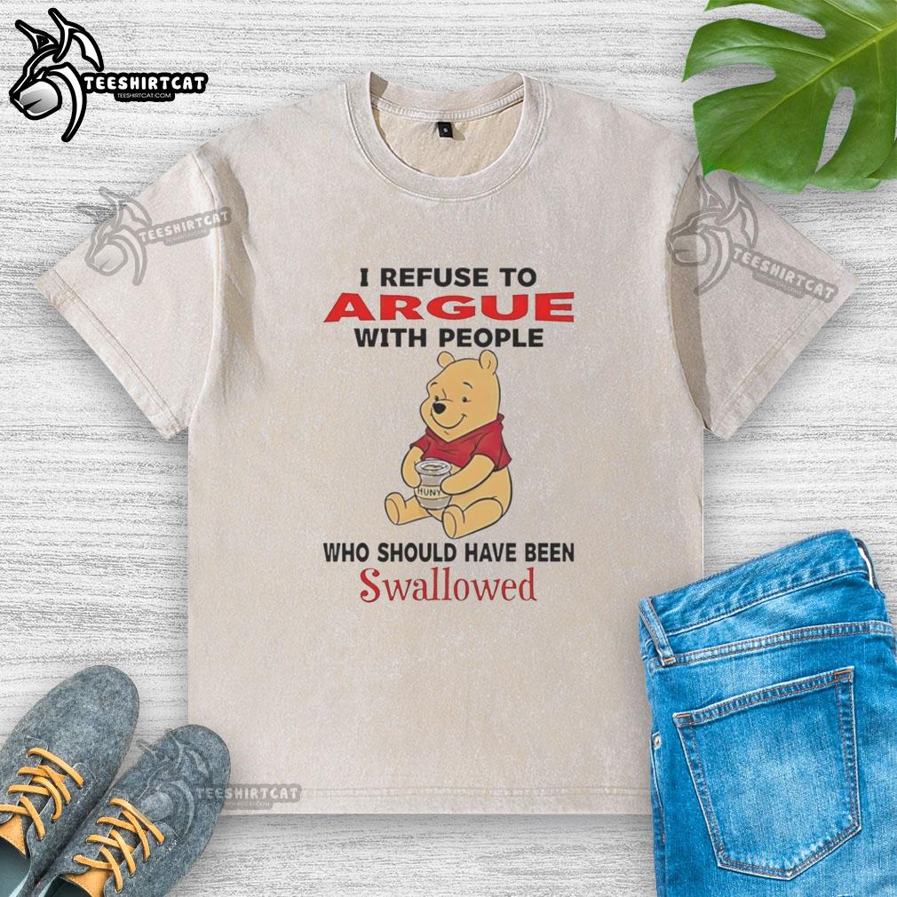 Cute Pooh Bear holding a humorous 'I refuse to argue with people' t-shirt, perfect for Disney fans and casual wear.
