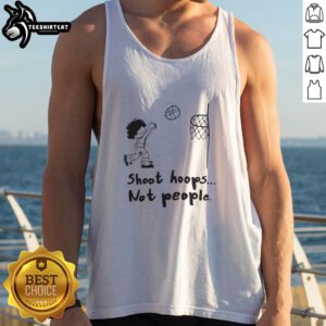 Person wearing a 'Nice Shoot Hoops Not People' tank top while playing basketball outdoors, showcasing a sporty vibe.