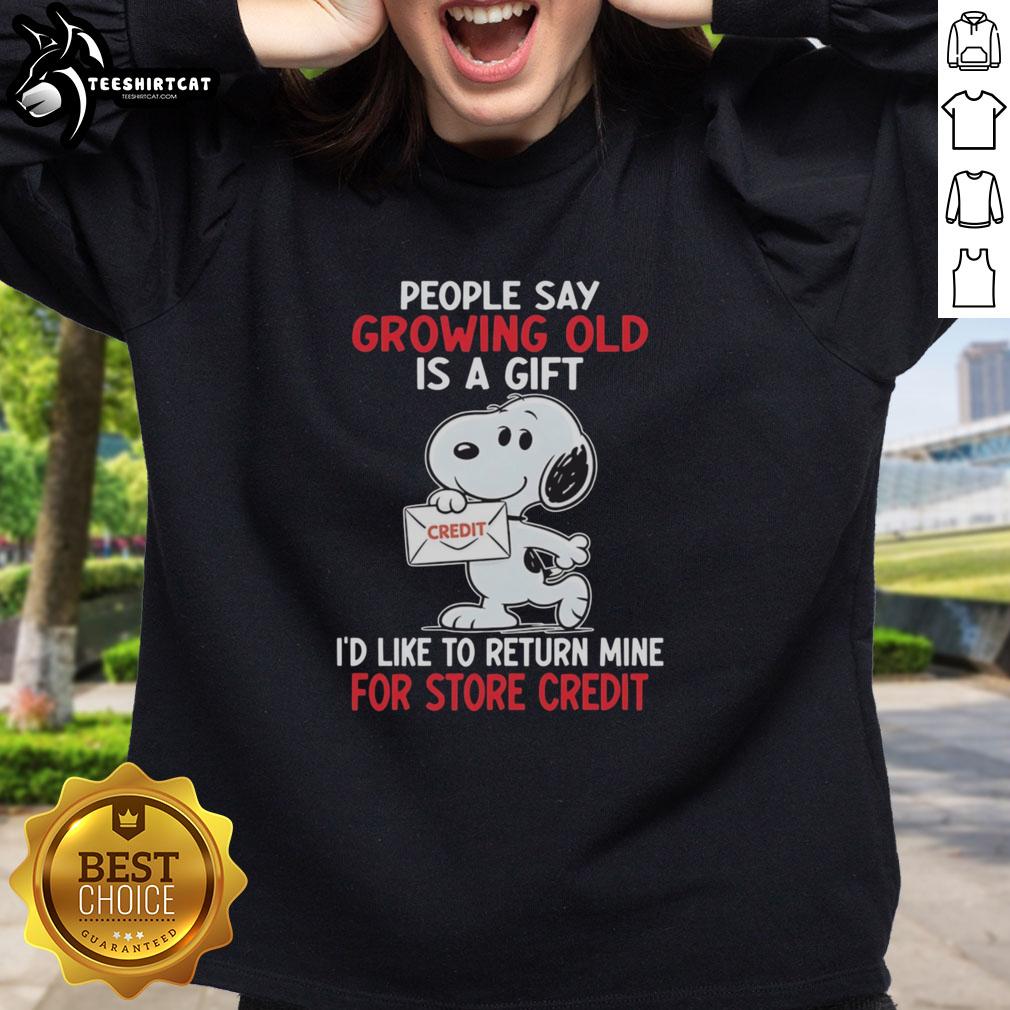 Snoopy sweatshirt featuring a humorous quote about aging, perfect for those who appreciate clever designs.