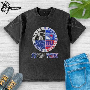 Official New York City sports logos on a washed t-shirt featuring Nets, Rangers, Giants, and Yankees designs.