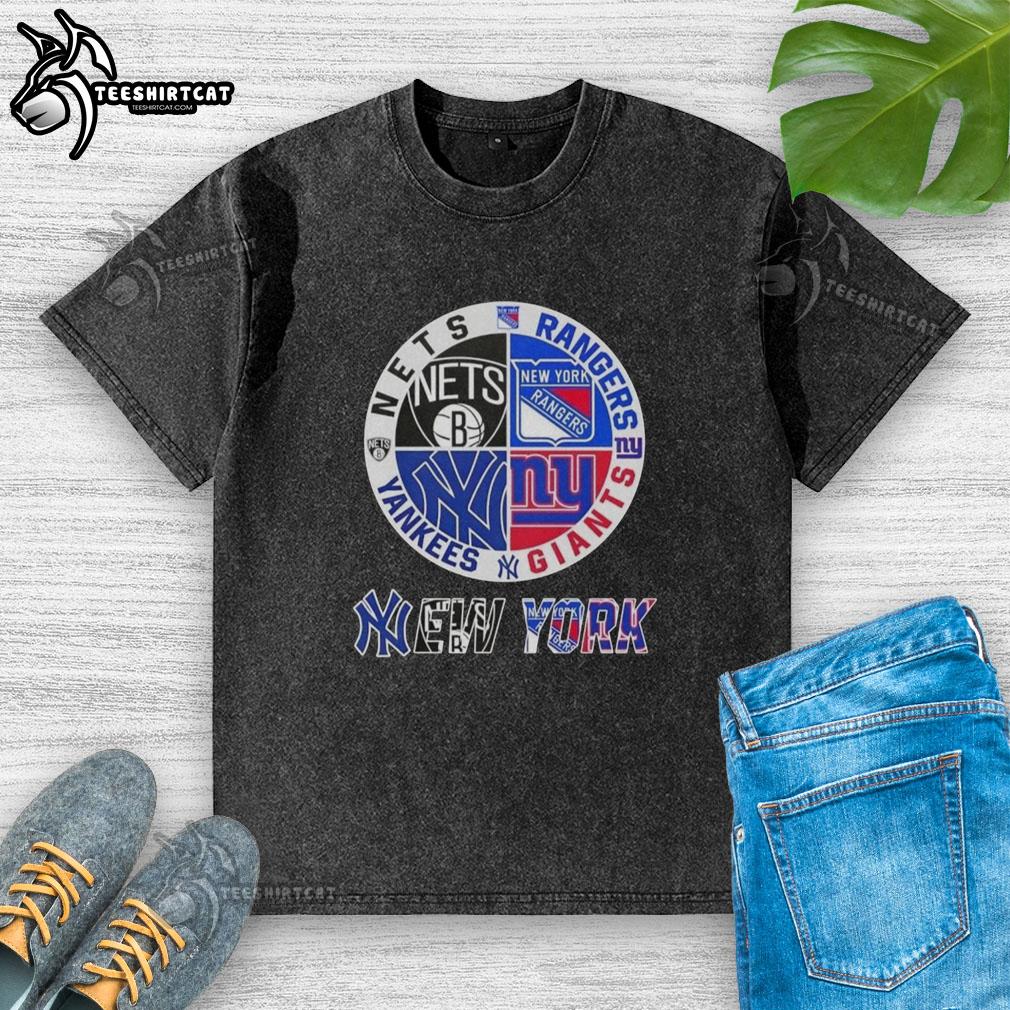 Official New York City sports logos on a washed t-shirt featuring Nets, Rangers, Giants, and Yankees designs.