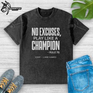 Official No Excuses Play Like A Champion Rule 76 Coop 1000 Games Washed T-Shirt displayed on a hanger, showcasing its design.
