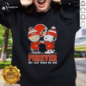 Official Peanut Snoopy and Charlie Brown Cleveland Browns sweatshirt, celebrating fandom with 'Forever Not Just When We Win' slogan.