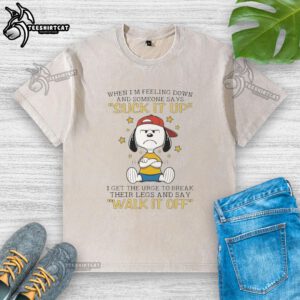 Official Snoopy t-shirt featuring a humorous quote about feeling down and breaking legs, perfect for Peanuts fans.