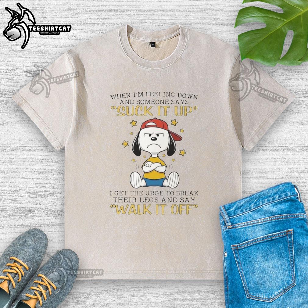Official Snoopy t-shirt featuring a humorous quote about feeling down and breaking legs, perfect for Peanuts fans.