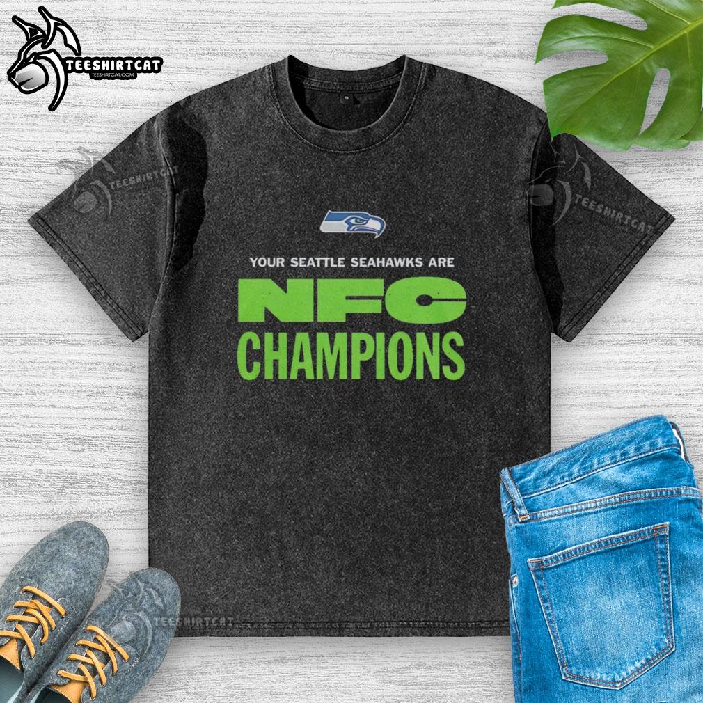 Alt Text: Original Seattle Seahawks NFC Champions logo on a washed t-shirt, perfect for fans celebrating the team's victory.