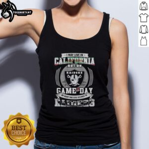 Premium tank top featuring 'I May Live In California, But My Heart Belongs To Las Vegas Raiders Football' design.
