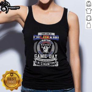 Premium tank top featuring 'I May Live In Colorado But My Heart Belongs To Las Vegas Raiders Football' design.